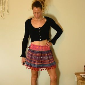 Colorful handmade skirt, pompoms and rainbow color